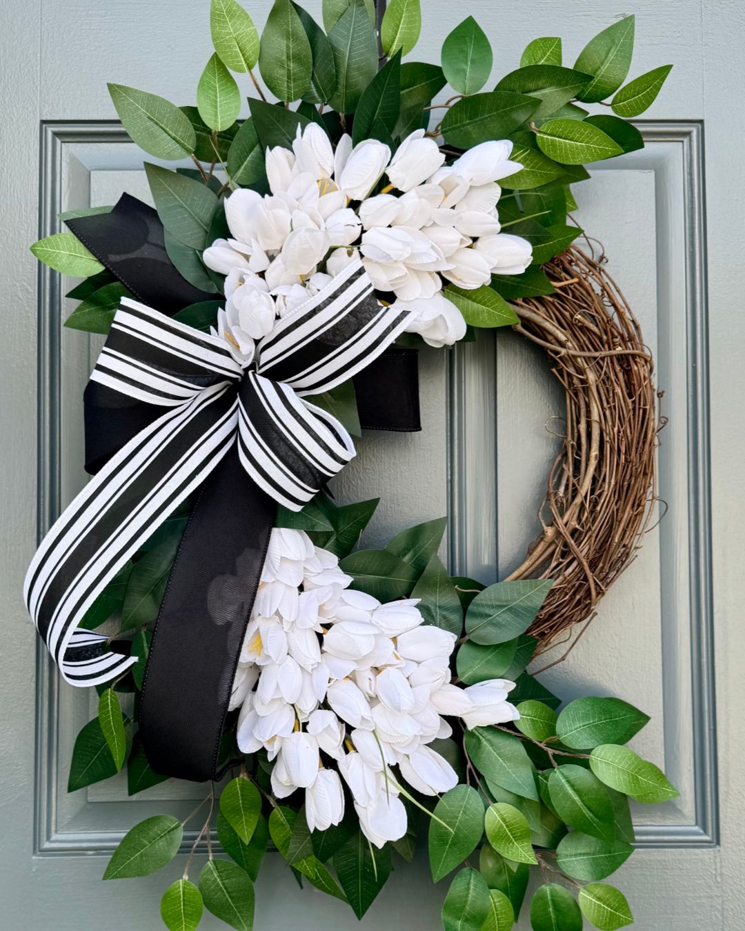 2. Contrast White Tulips With a Striped Bow