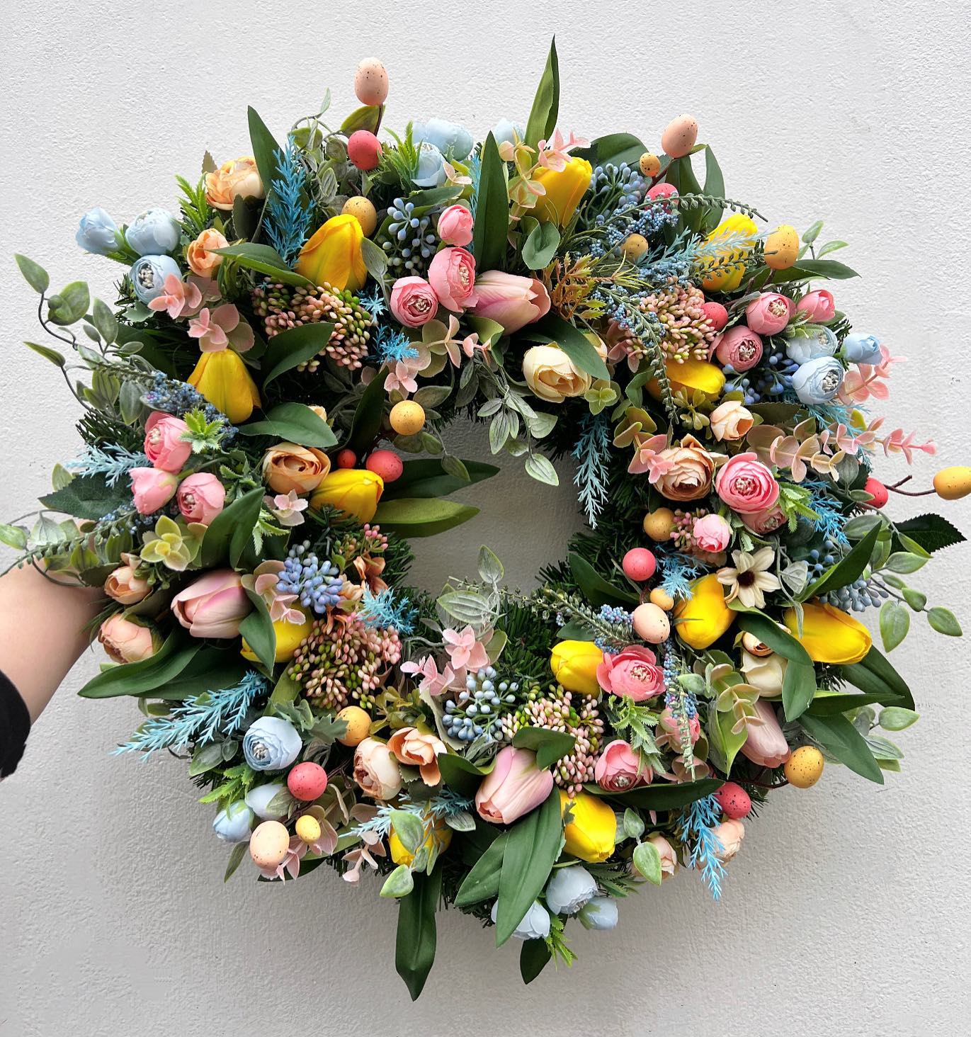 17. Nestle Pastel Eggs Among Spring Tulips
