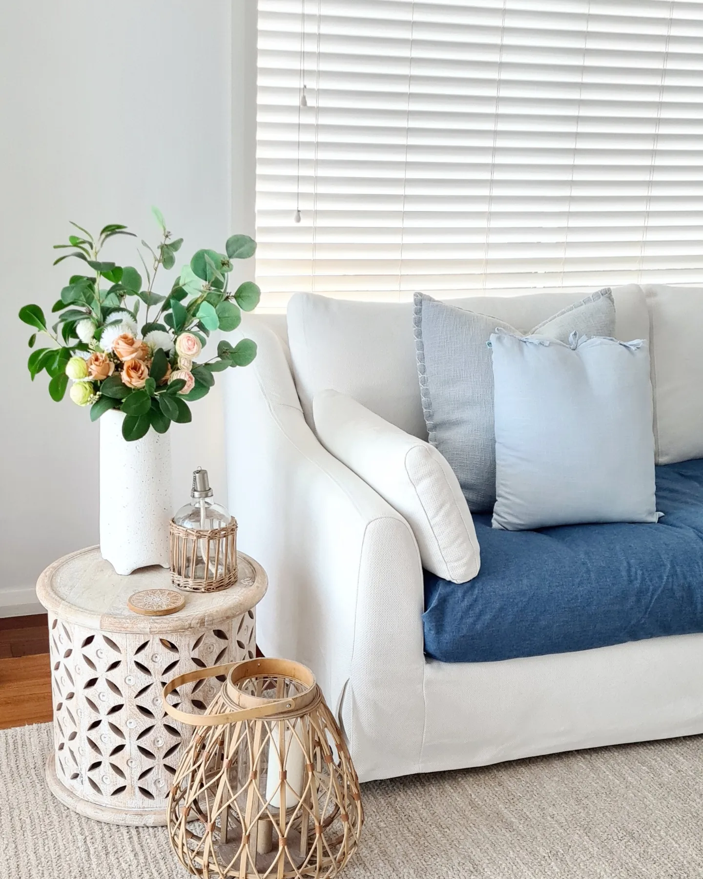 7. Lighten a Sofa Corner With Blue and White Layers