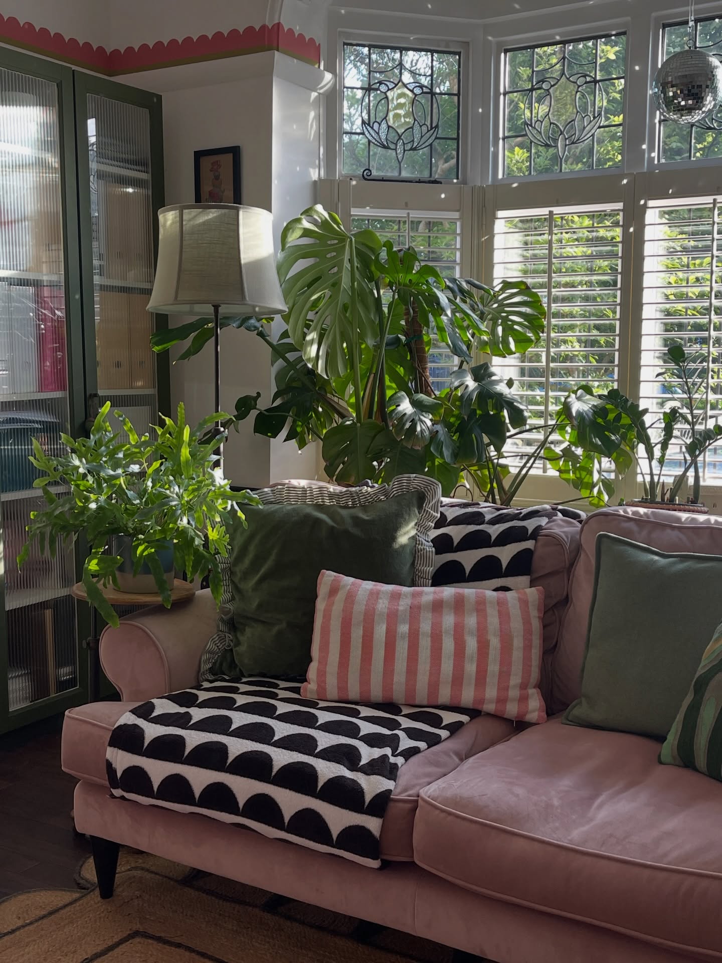 9. Build a Leafy Spring Corner Around a Pink Sofa