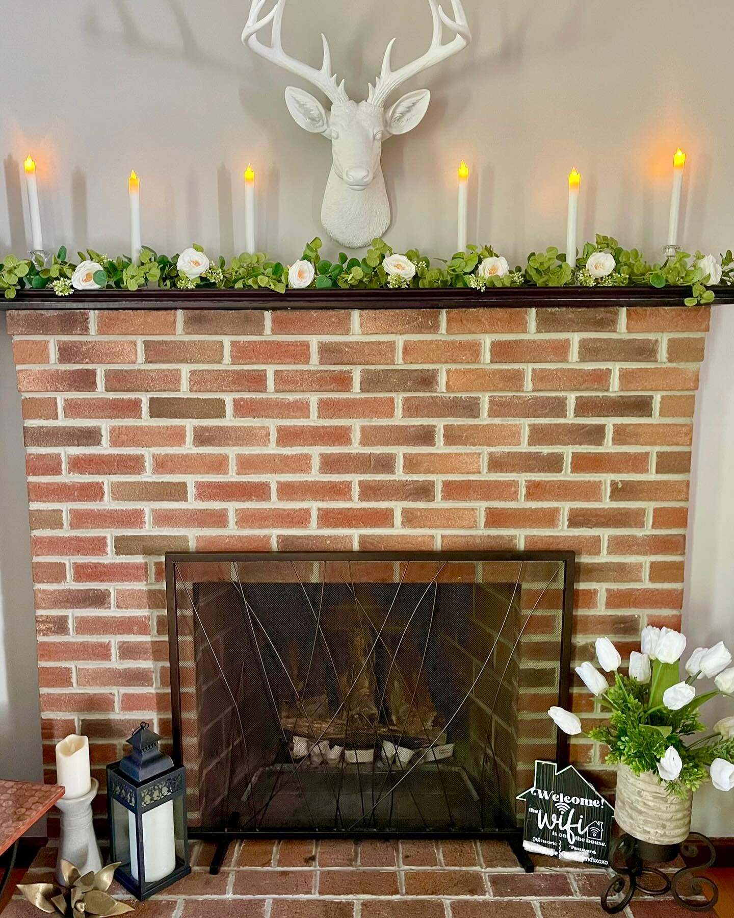 8. Trace a Narrow Mantel With White Blooms