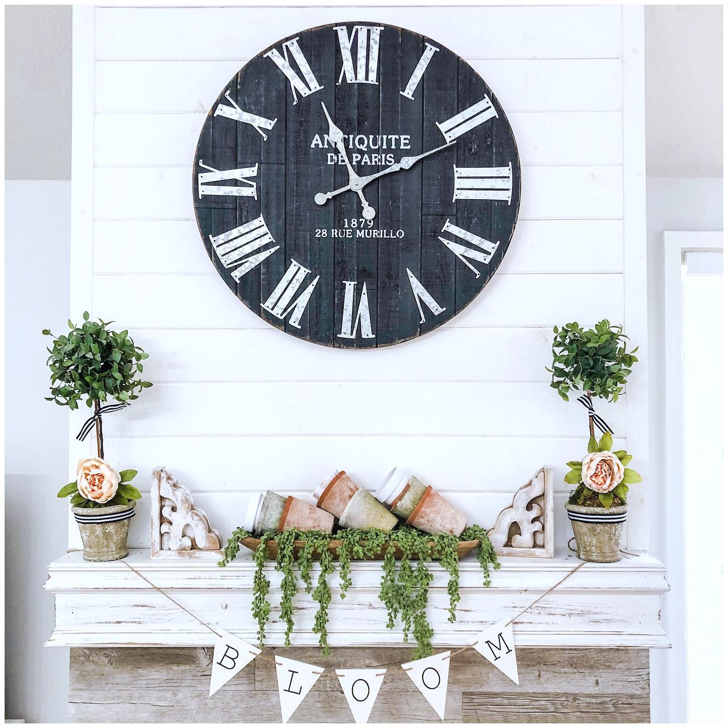 12. Hang a Bloom Banner Beneath Tilted Pots