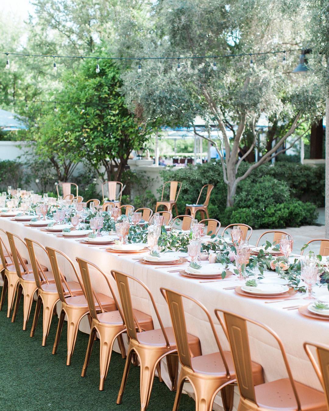 17. A Greenery Garland along a Garden Table