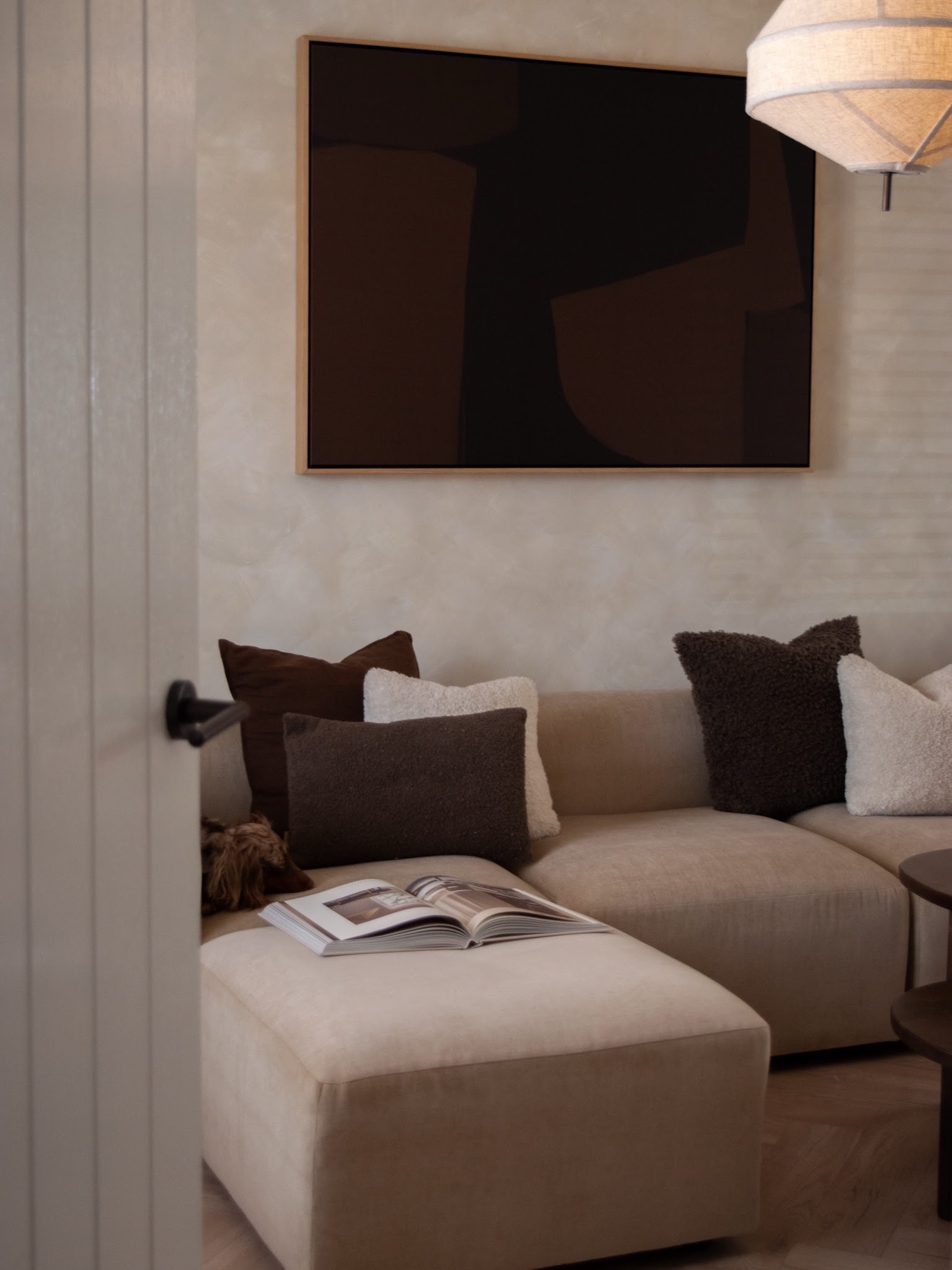 10. Chocolate Pillows on a Taupe Modular Sofa