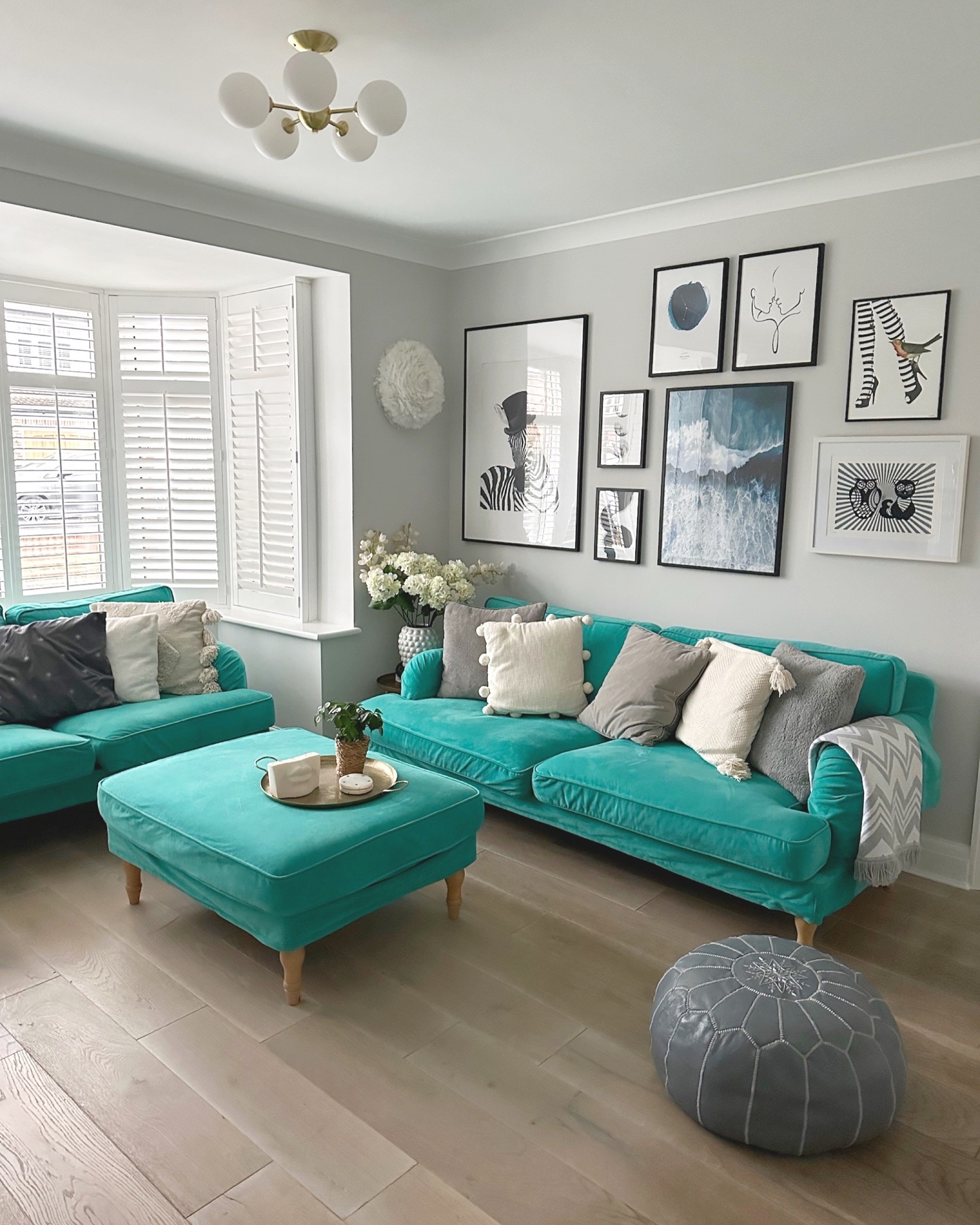 12. Make Teal Seating the Color in a Gray Room