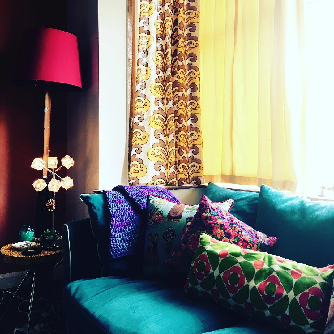 15. Layer Retro Prints Over a Teal Sofa