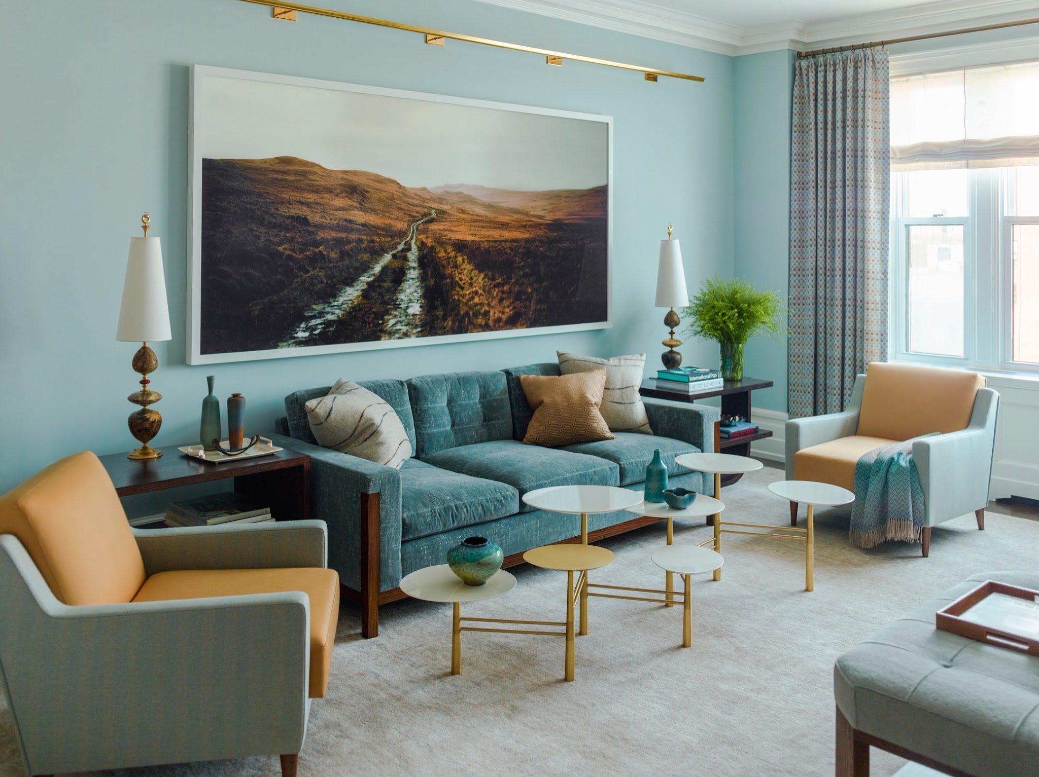 16. Warm Teal Seating With Brass Toned Accents