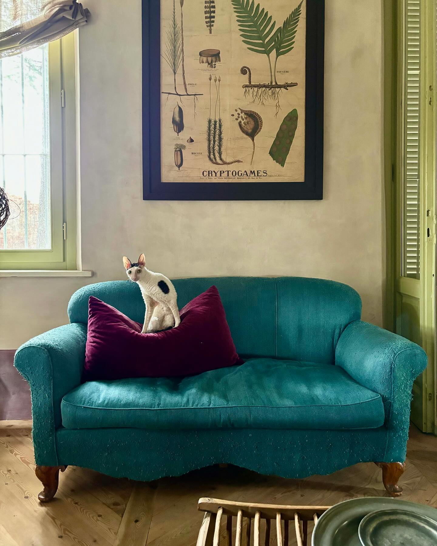 20. Pair a Vintage Teal Loveseat With Burgundy
