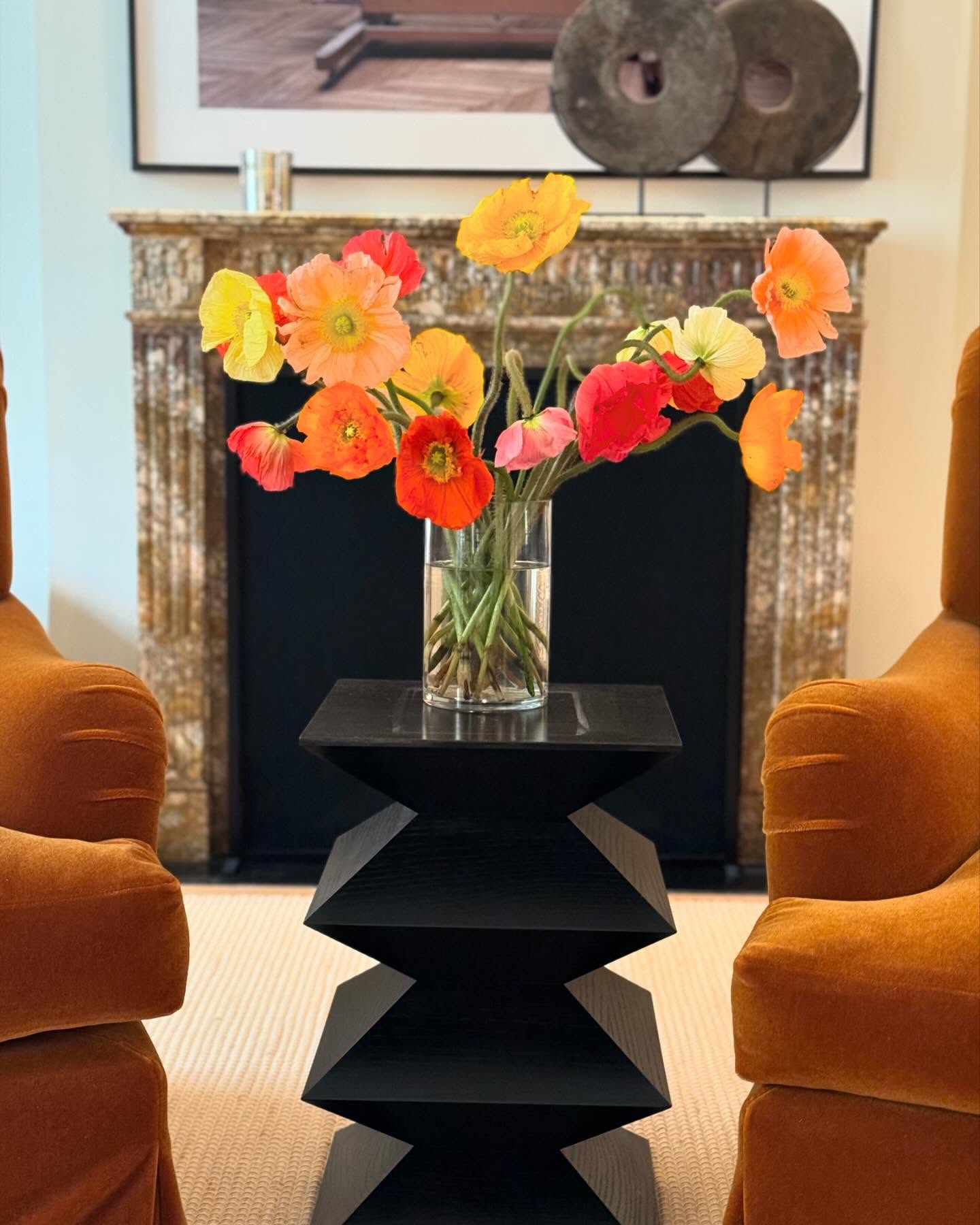12. Put a Black Table Between Warm Chairs