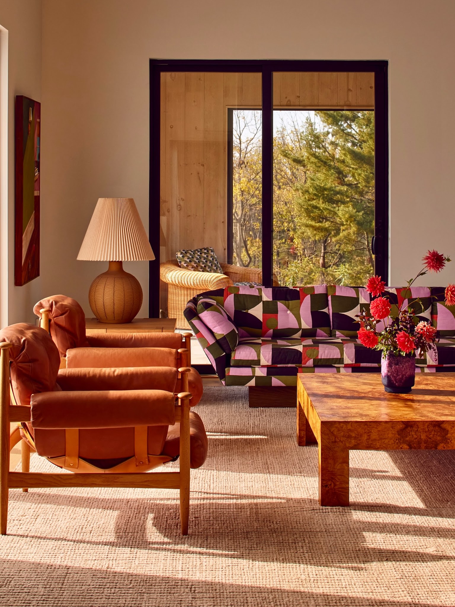 18. Set Rust Armchairs Beside a Bold Patterned Sofa