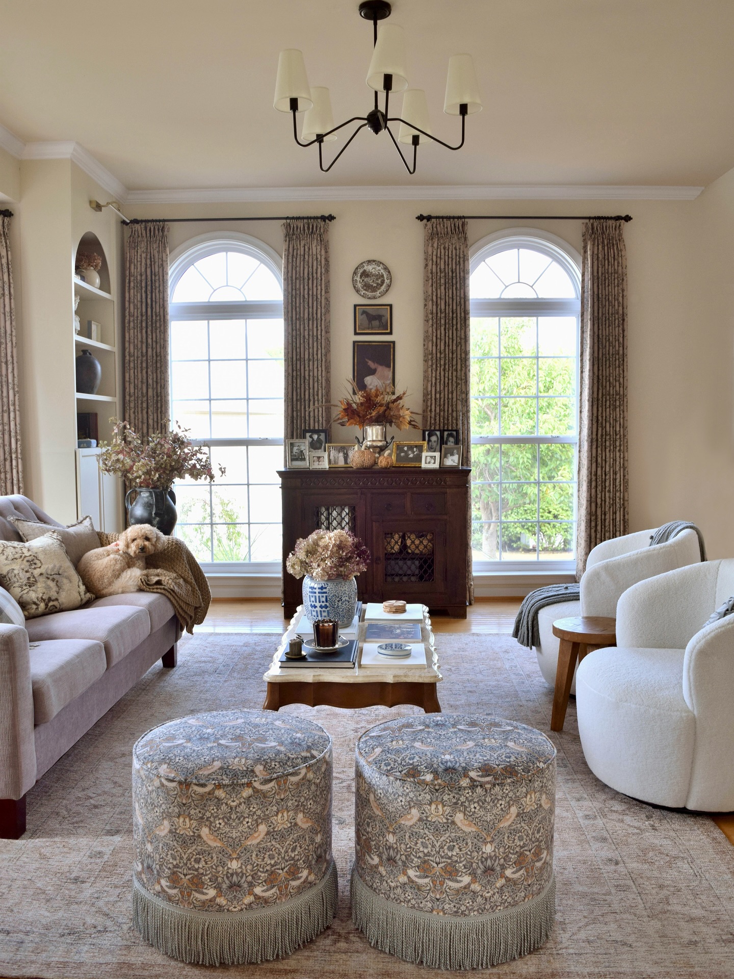 4. Frame Tall Windows With Floral Curtains