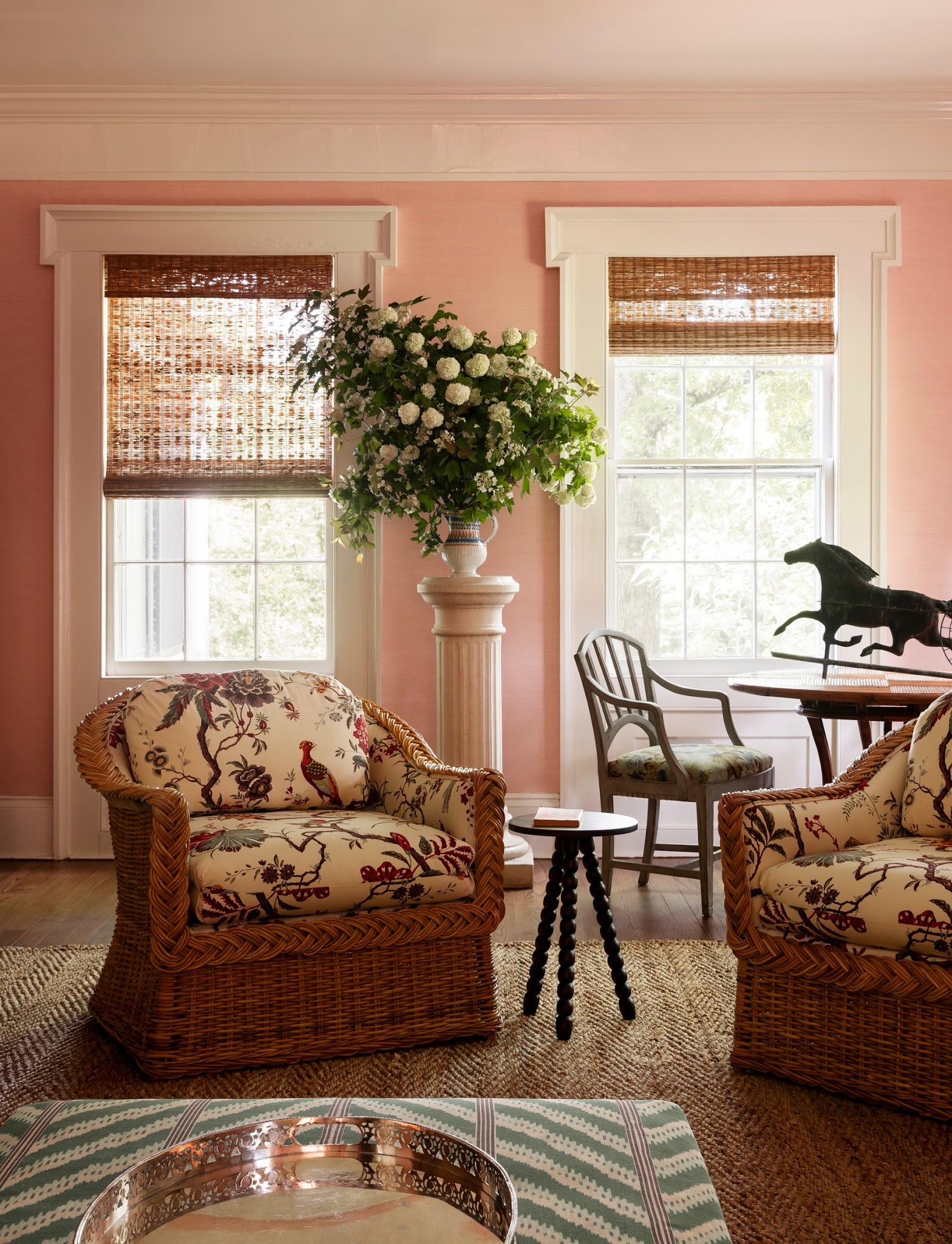 8. Warm Classic Seating With Soft Pink Walls