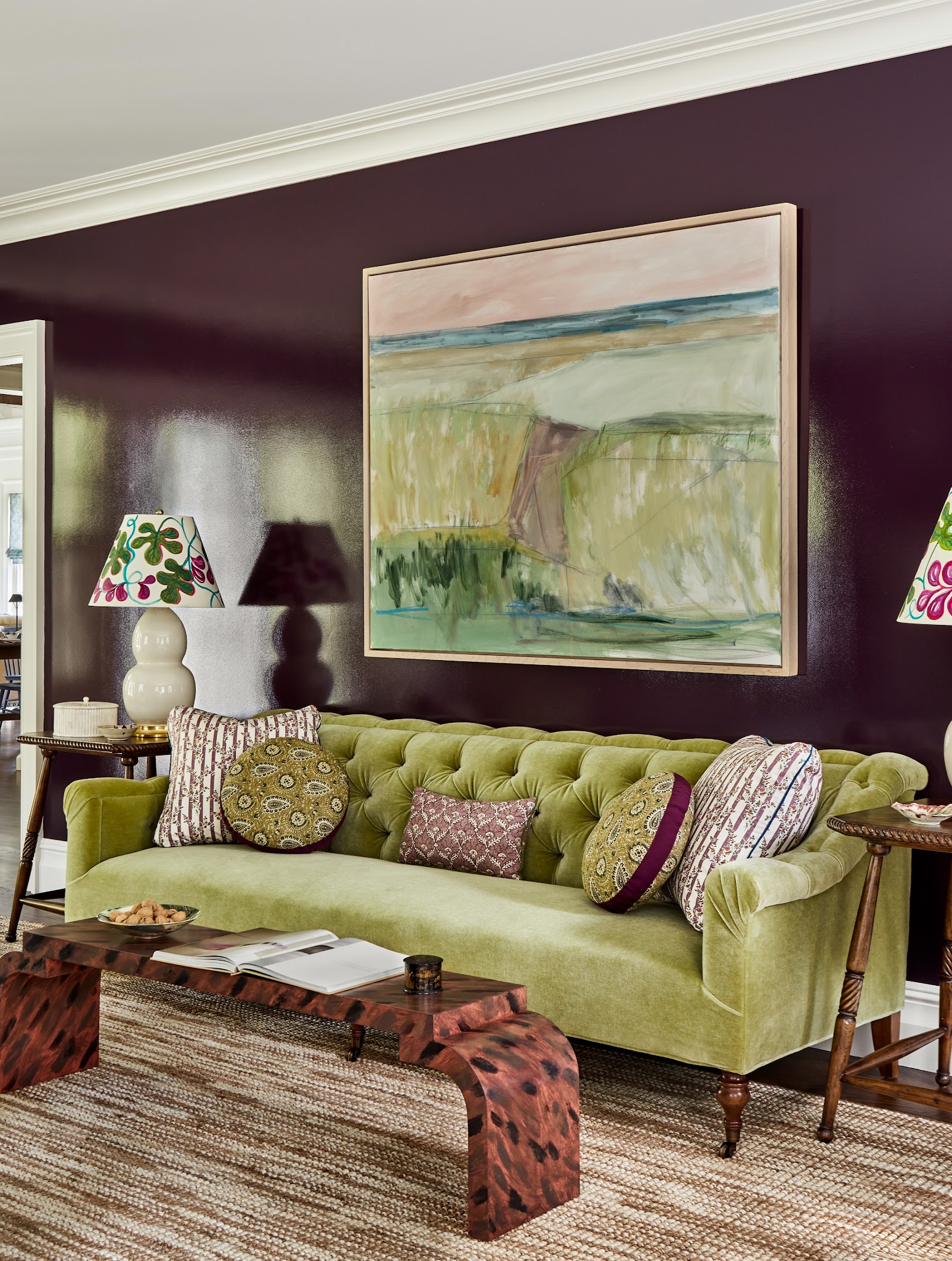 15. Pair a Green Tufted Sofa With Plum Walls