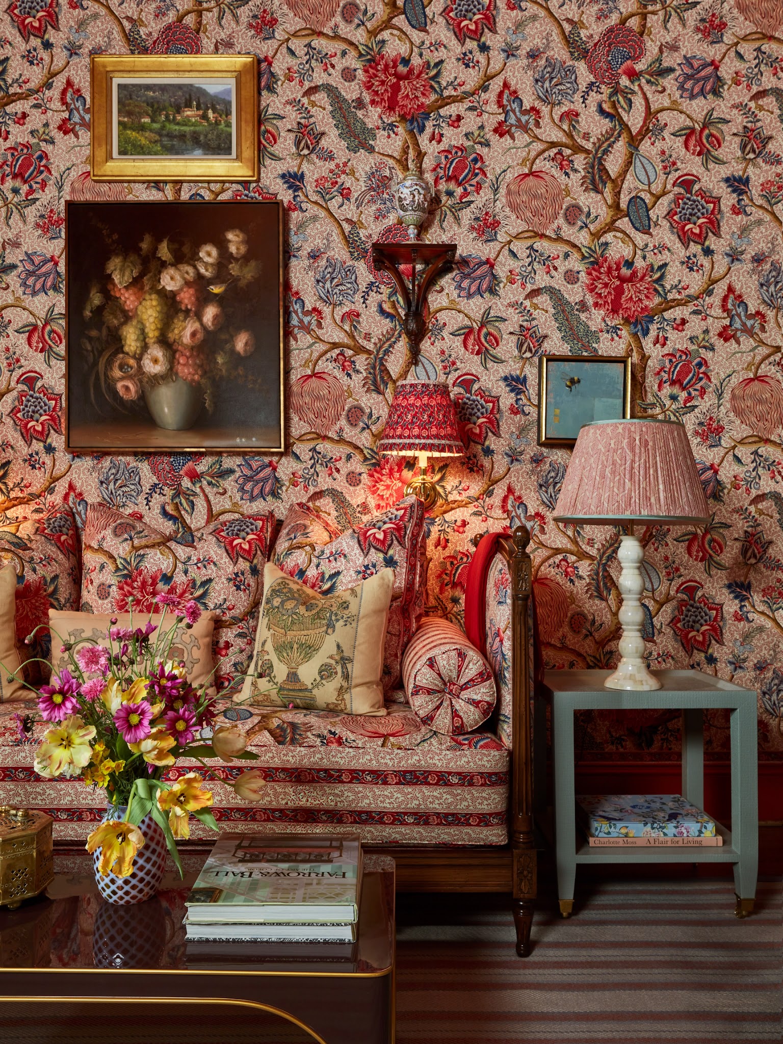 20. Layer Bold Florals Around a Traditional Sofa