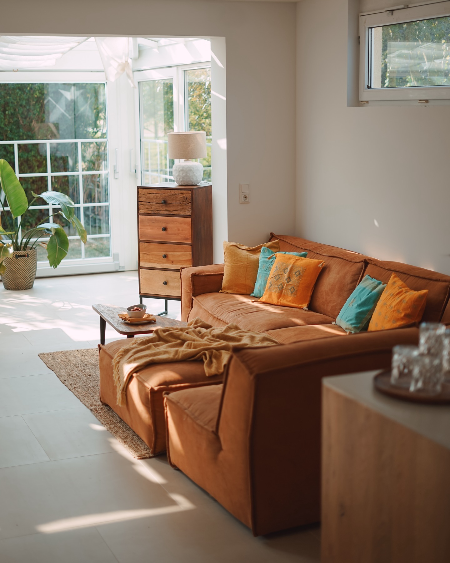 3. Warm Up Tropical Green With Sunset Cushions