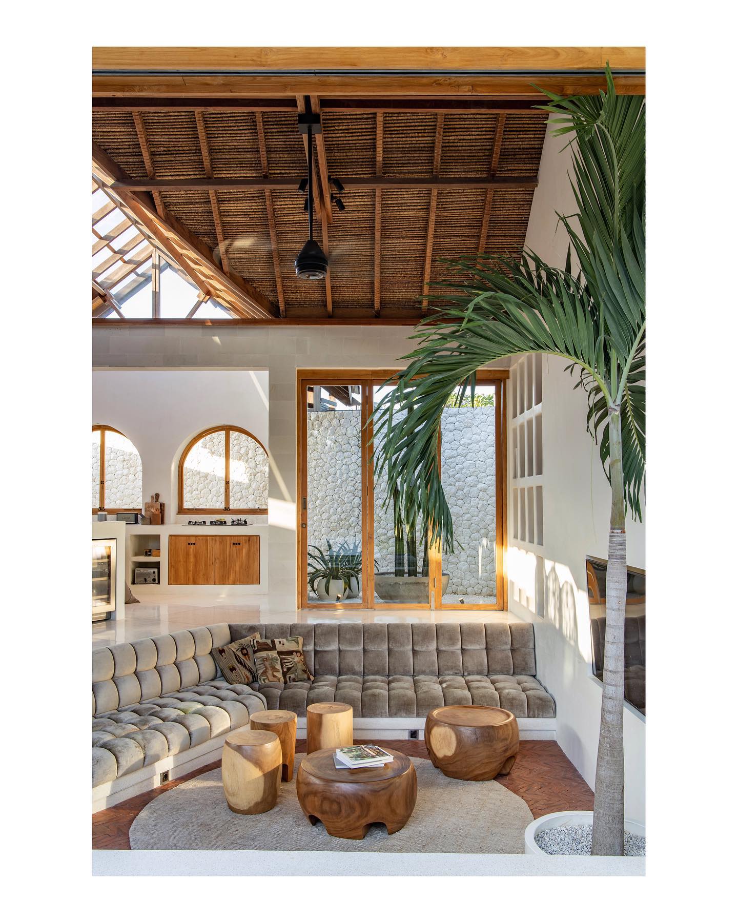 15. Gather Low Seating Around Sculptural Wood Tables
