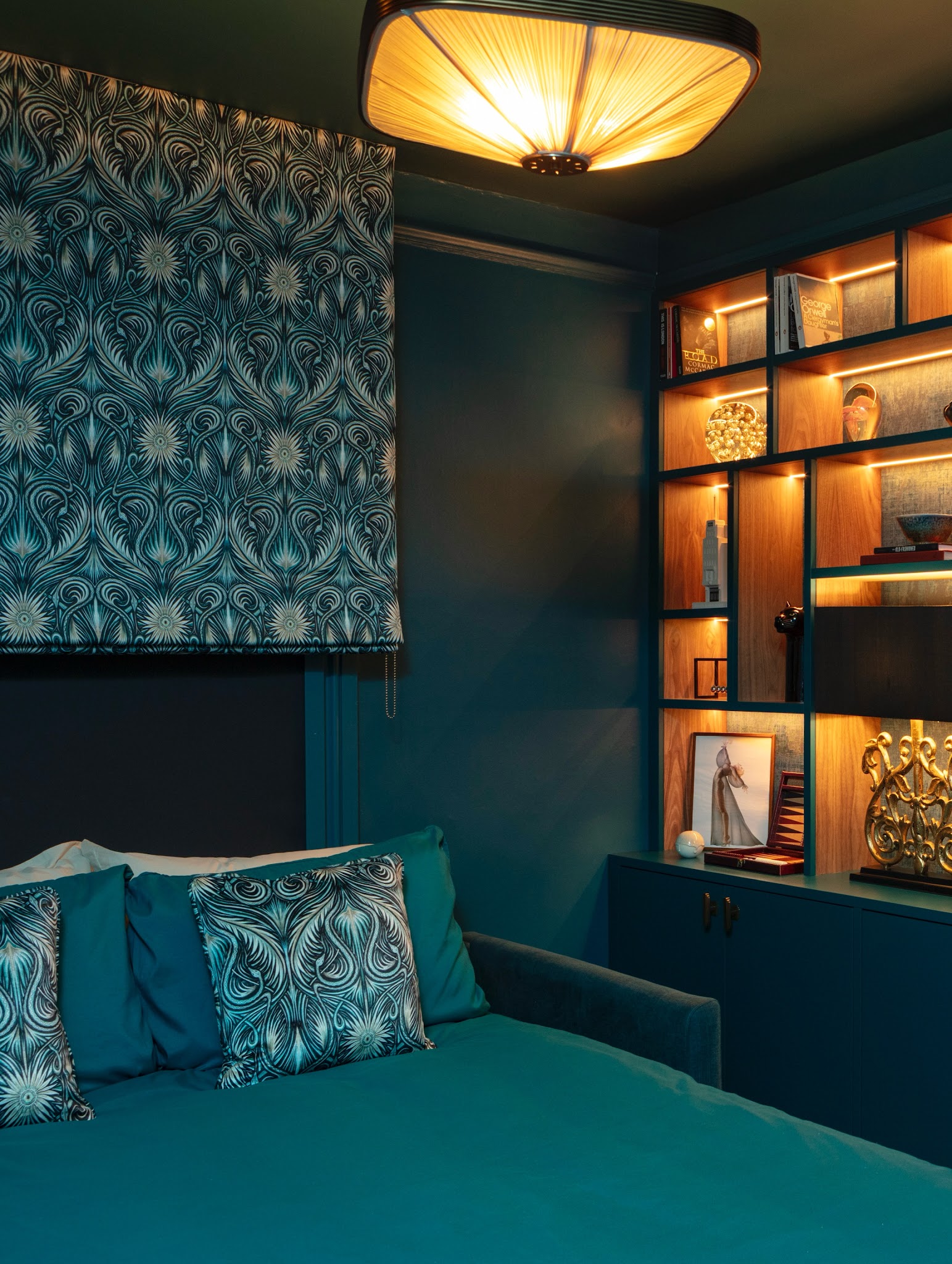 7. Warm a Deep Turquoise Snug with Shelf Lighting