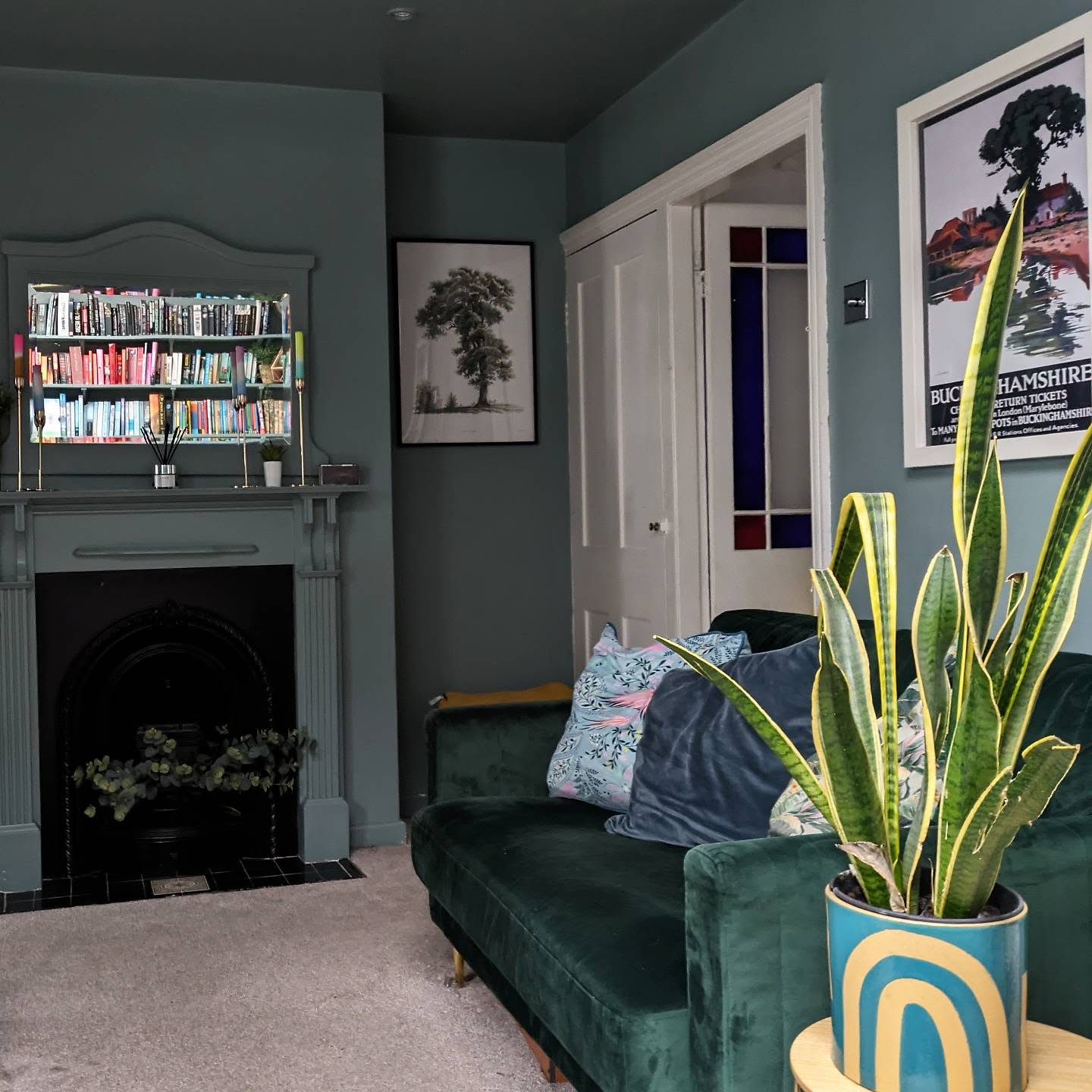2. Carry Teal Across the Walls and Mantel