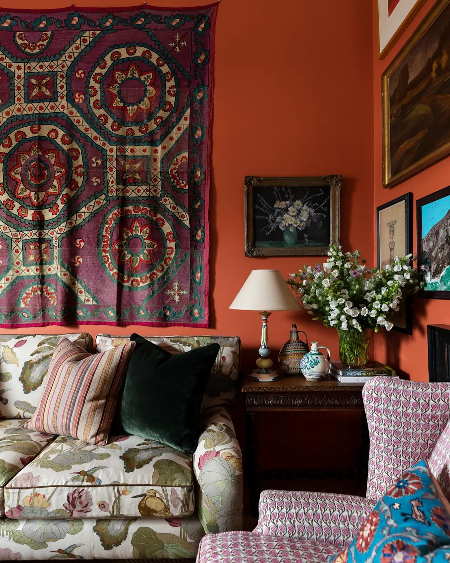 3. Layer Floral Upholstery with a Decorative Wall Hanging