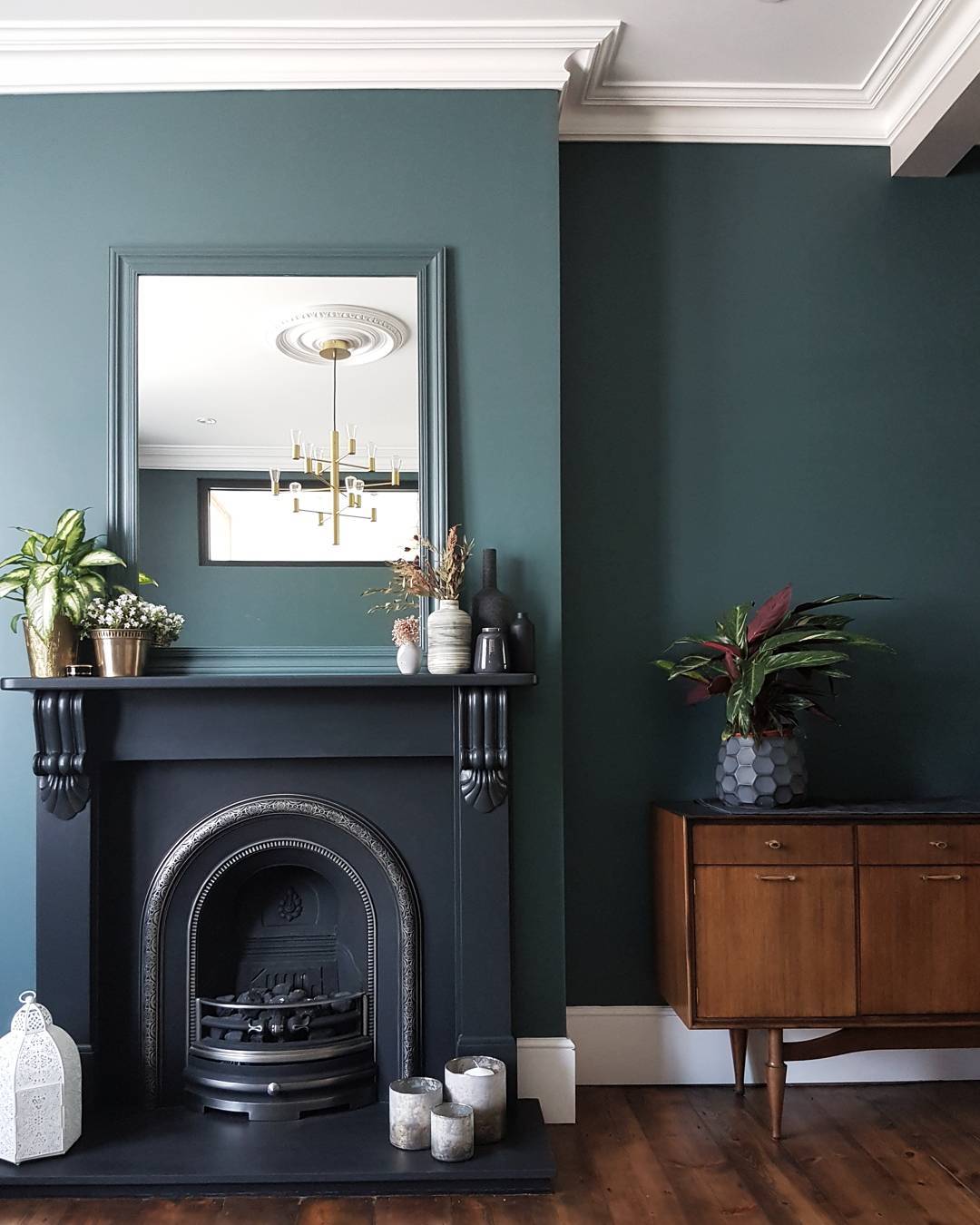 9. Pair an Ornate Fireplace with a Simple Wood Cabinet
