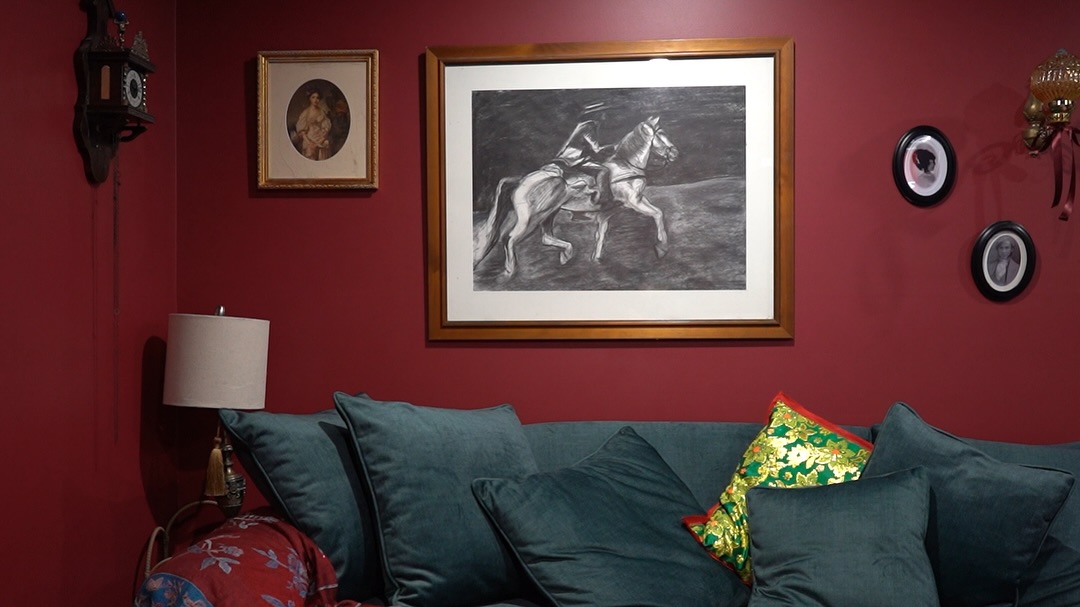 10. Combine Red Walls with Green Seating and Vintage Pictures