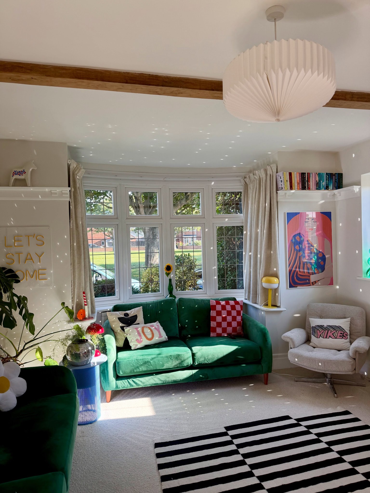 17. Combine a Green Sofa With Graphic Flooring