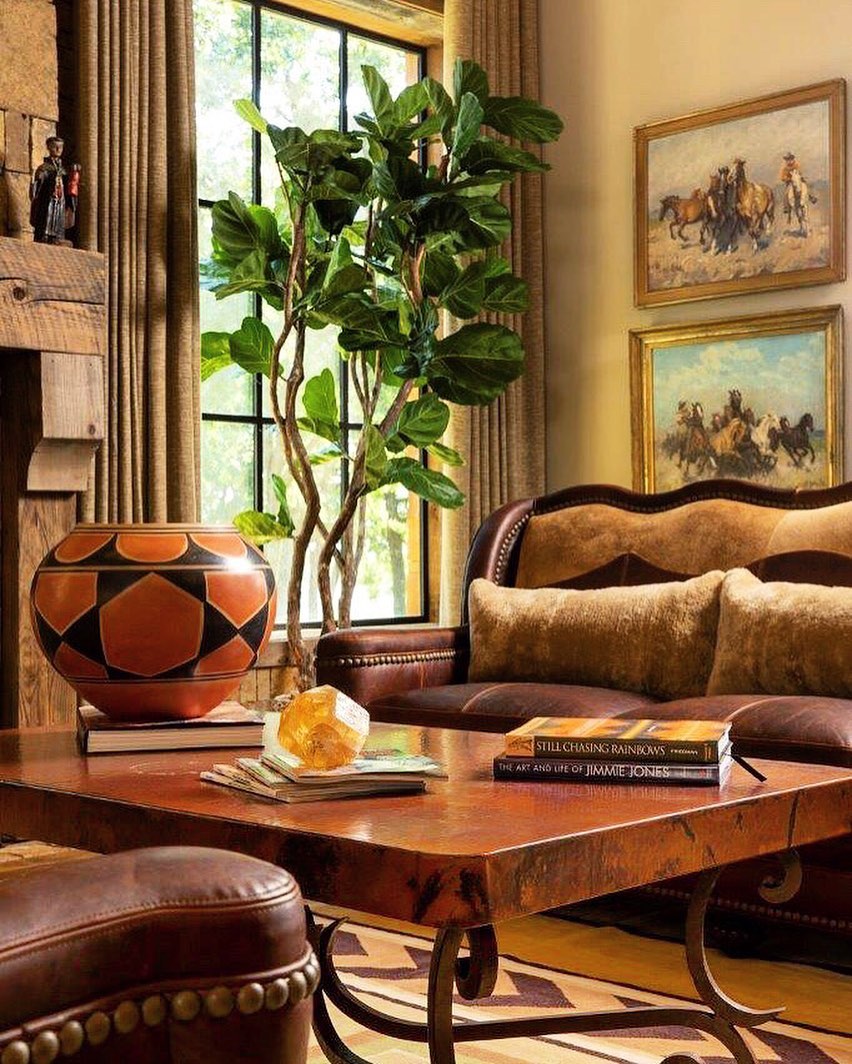 3. Gather Western Paintings Above a Carved Sofa