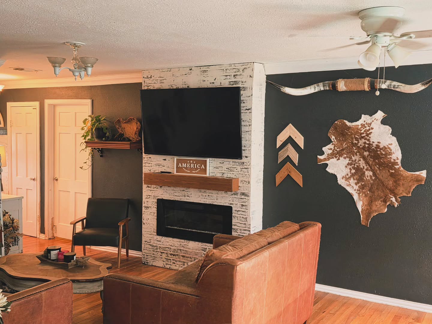 13. Display a Cowhide Against a Dark Wall