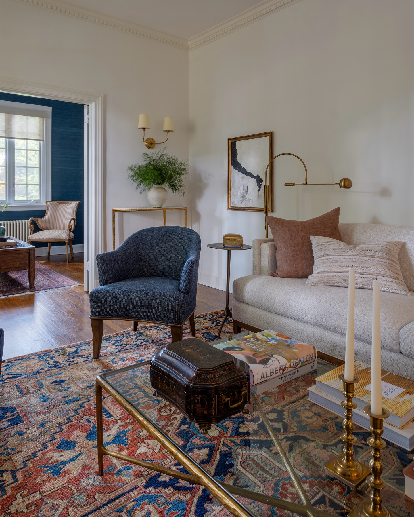 3. Balance a Patterned Rug with a Tailored White Sofa