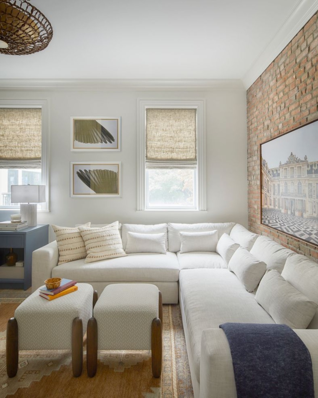 4. Soften Exposed Brick with a White Corner Sectional