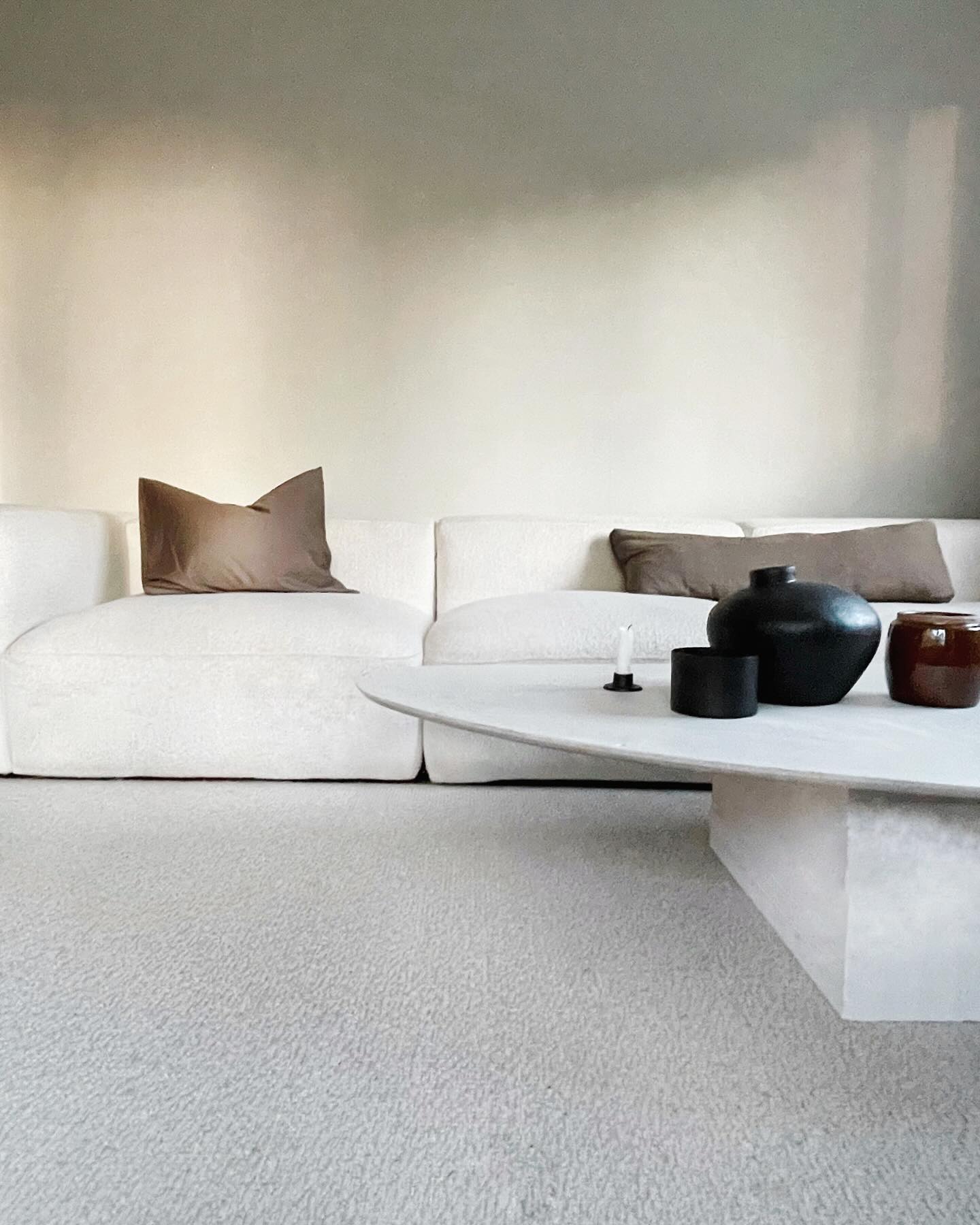 6. Keep a White Sofa Minimal with Sculptural Contrast