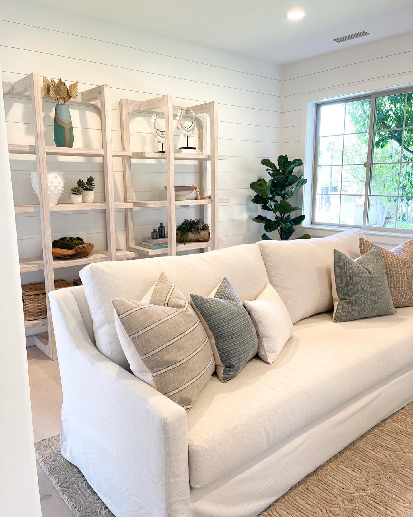7. Float a White Sofa in Front of Open Shelving