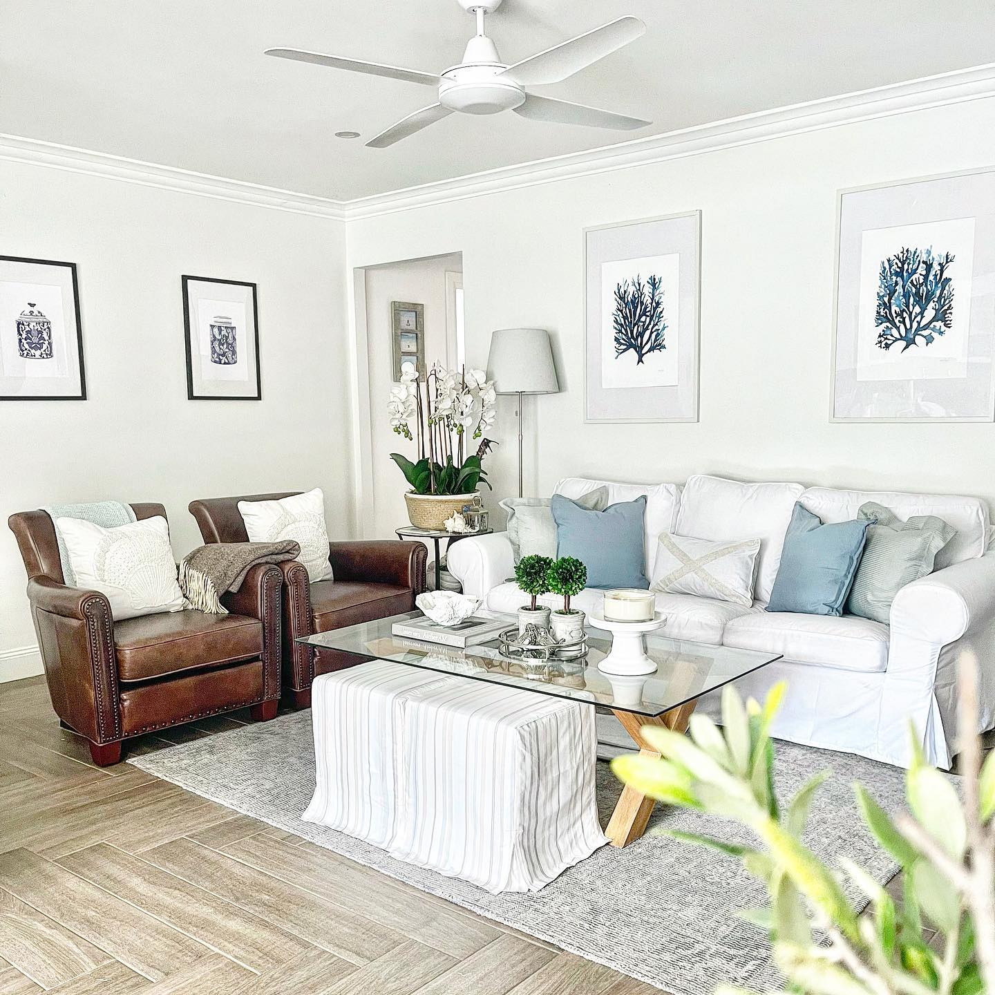 9. Add Hidden Extra Seats Around a White Slipcovered Sofa