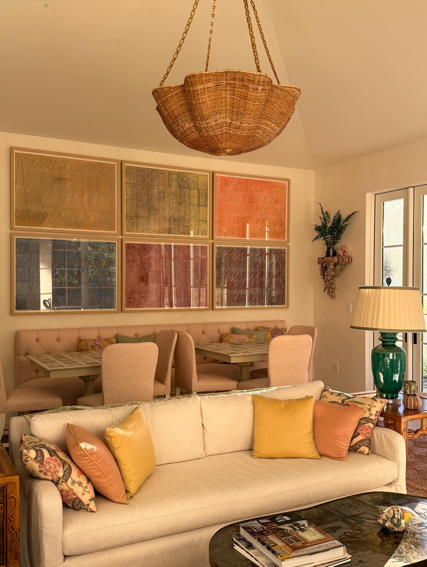 19. Warm a White Couch with Gold and Coral Pillows