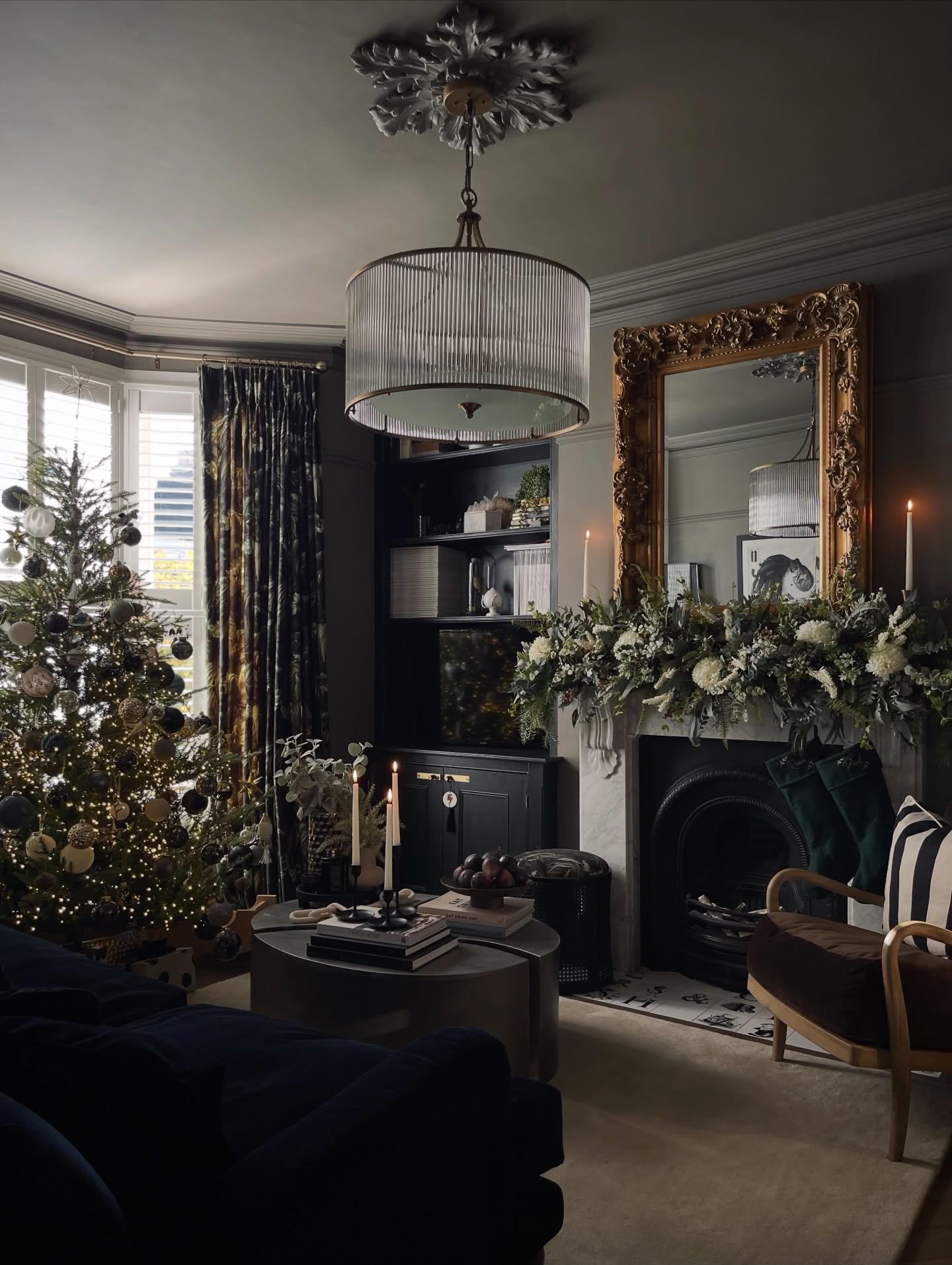 19. Pair a Botanical Mantel With an Ornate Gold Mirror