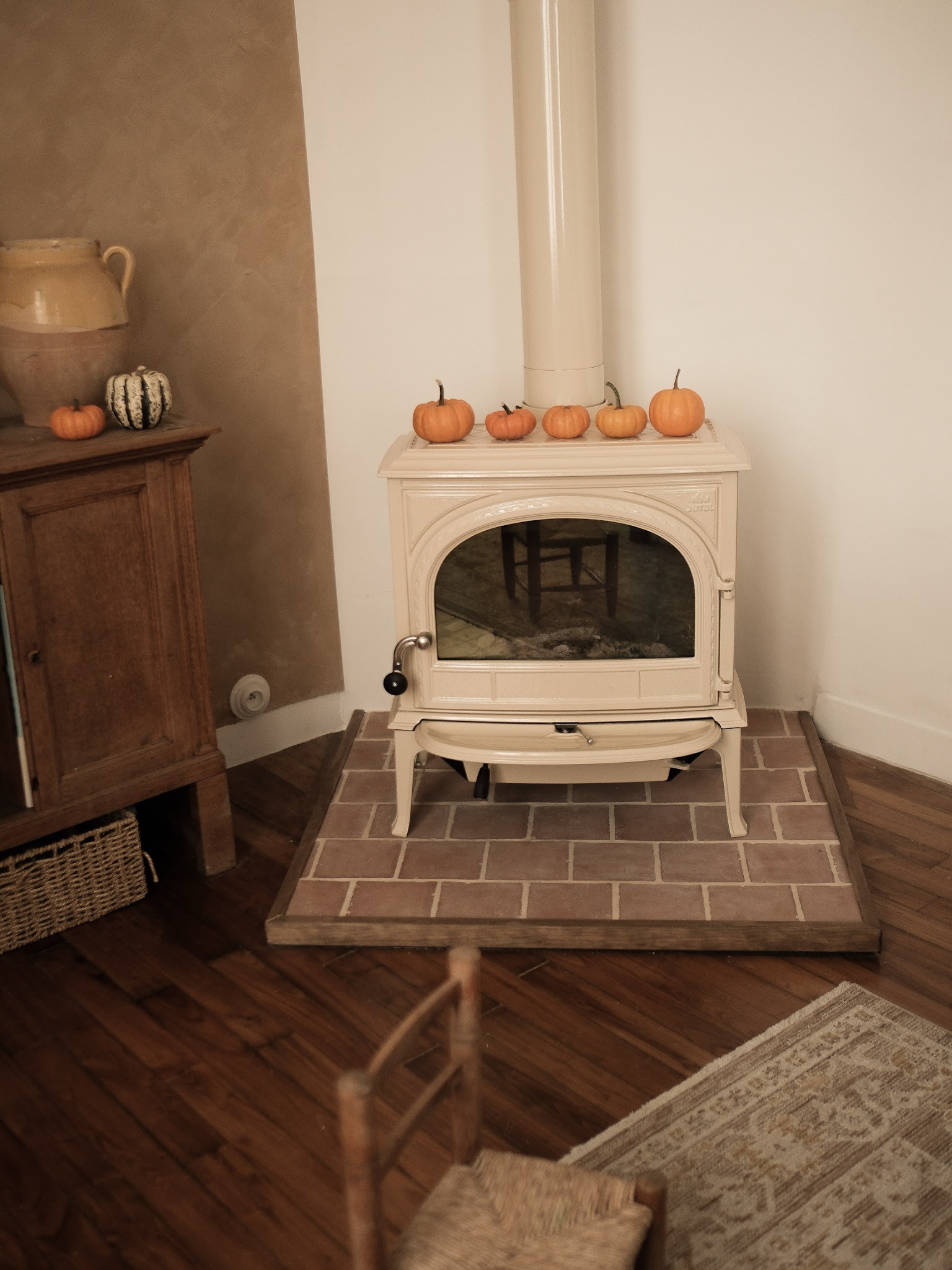 19. Soften a Cottage Corner with a Cream Stove